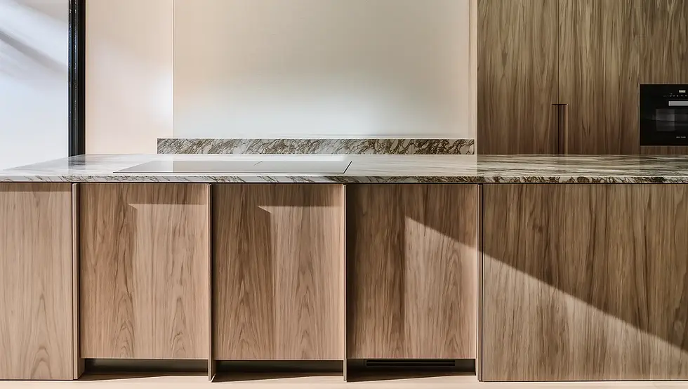 Modern Melbourne kitchen design featuring custom walnut cabinetry, marble waterfall benchtop, and seamless integrated appliances