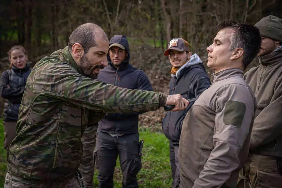 Zurab Tskitishvili, Instructor Delta, demonstrating Krav Maga knife defense techniques during a training session at Delta Survival School