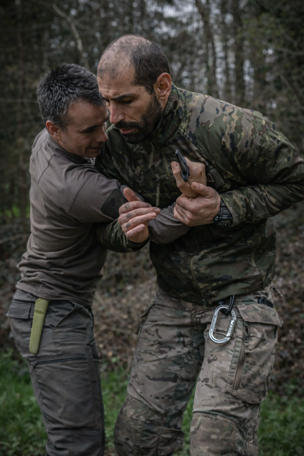 Instructor demonstrating a close-contact self-defense exercise outdoors