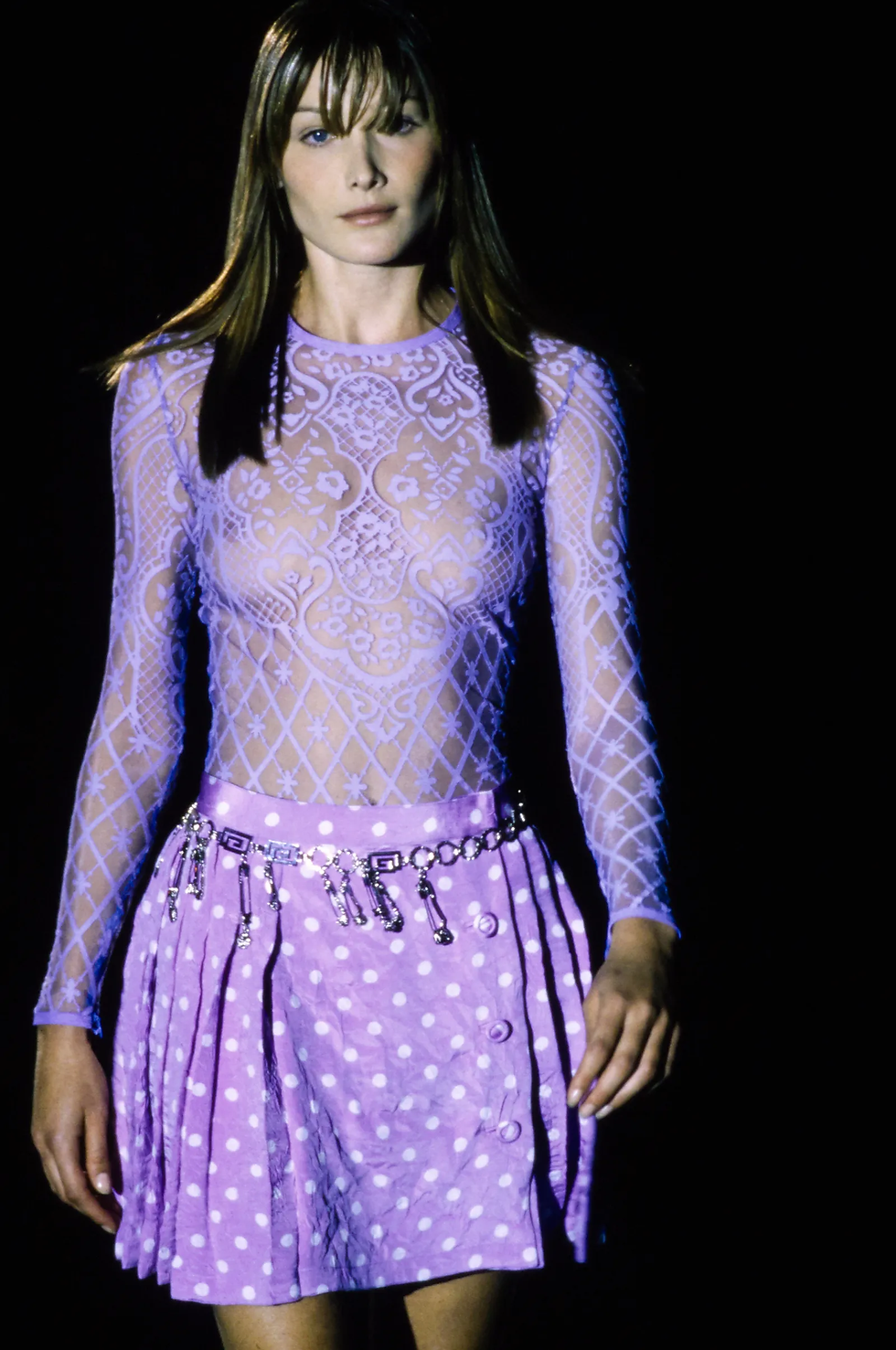 The polka dots, pastel and chain belt are also included in the Dua Lipa x Versace collection. Carla Bruni wearing lilac Versace at the Versace Spring 1994 show.