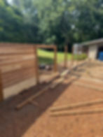 Wooden privacy fence under construction