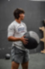 Athlete Prepping a Medicine Ball Exercise