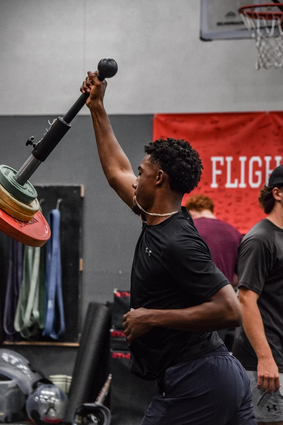 Athlete performing a landmine press