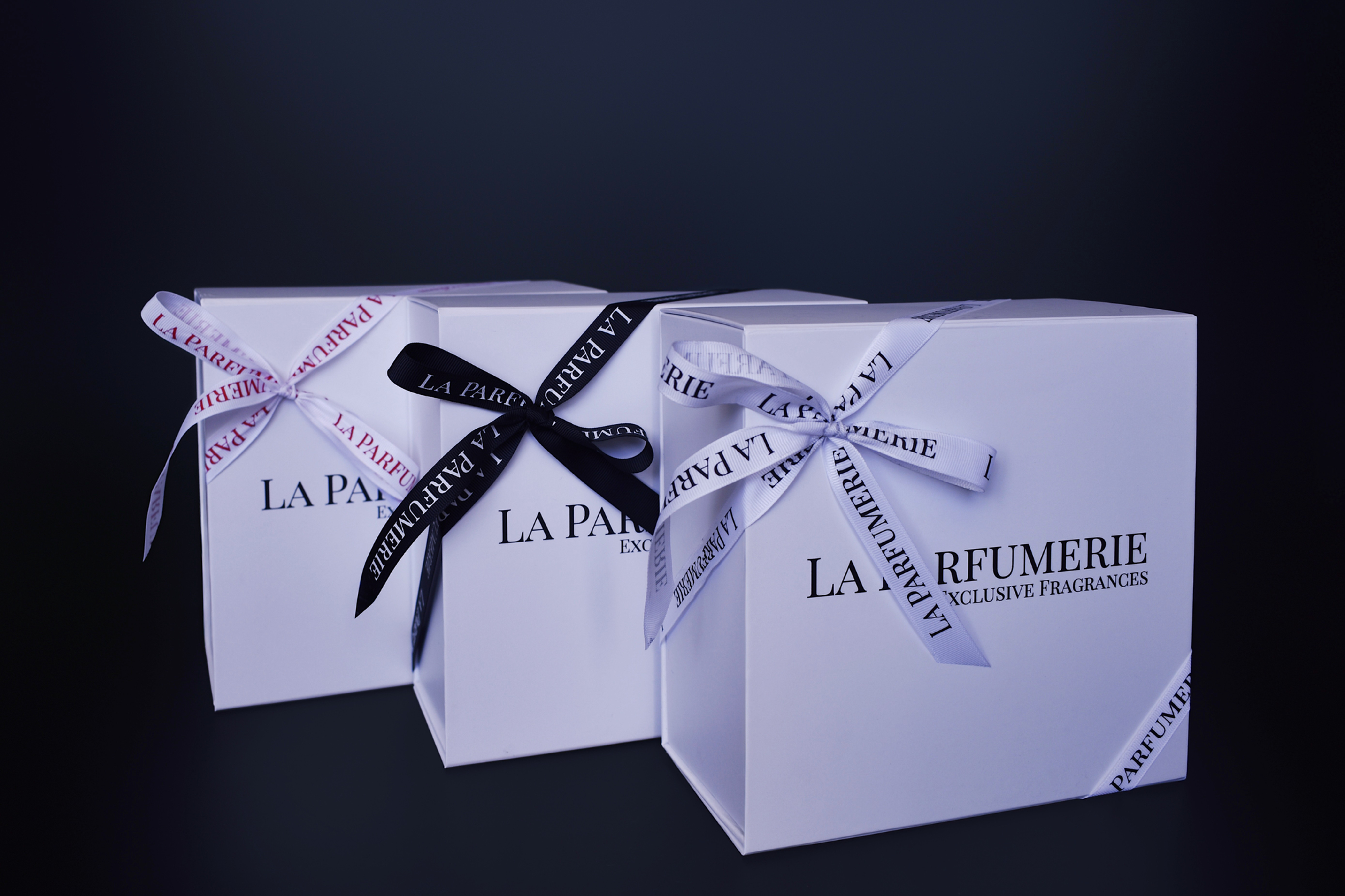 La Parfumerie gift boxes tied with our signature ribbon
