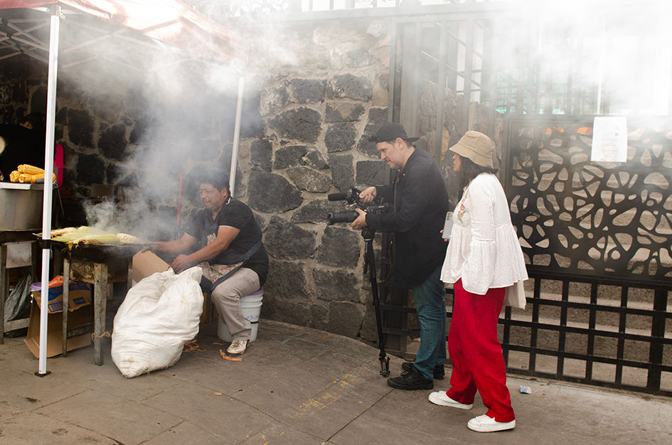 Iván Aguirre and producer, Maricarmen Berumen, filming an Elotero (corn seller) in Milpa Alata, Mexico City