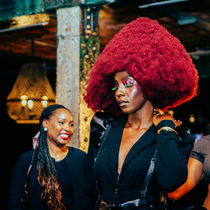 Promise Okoye working on a professional textured-hair industry project