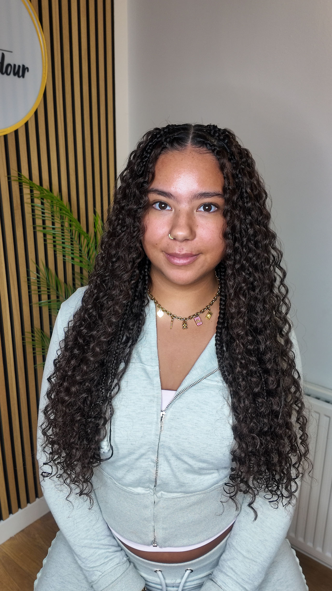 Young girl wearing Long knotless braids with a lightweight natural-looking finish