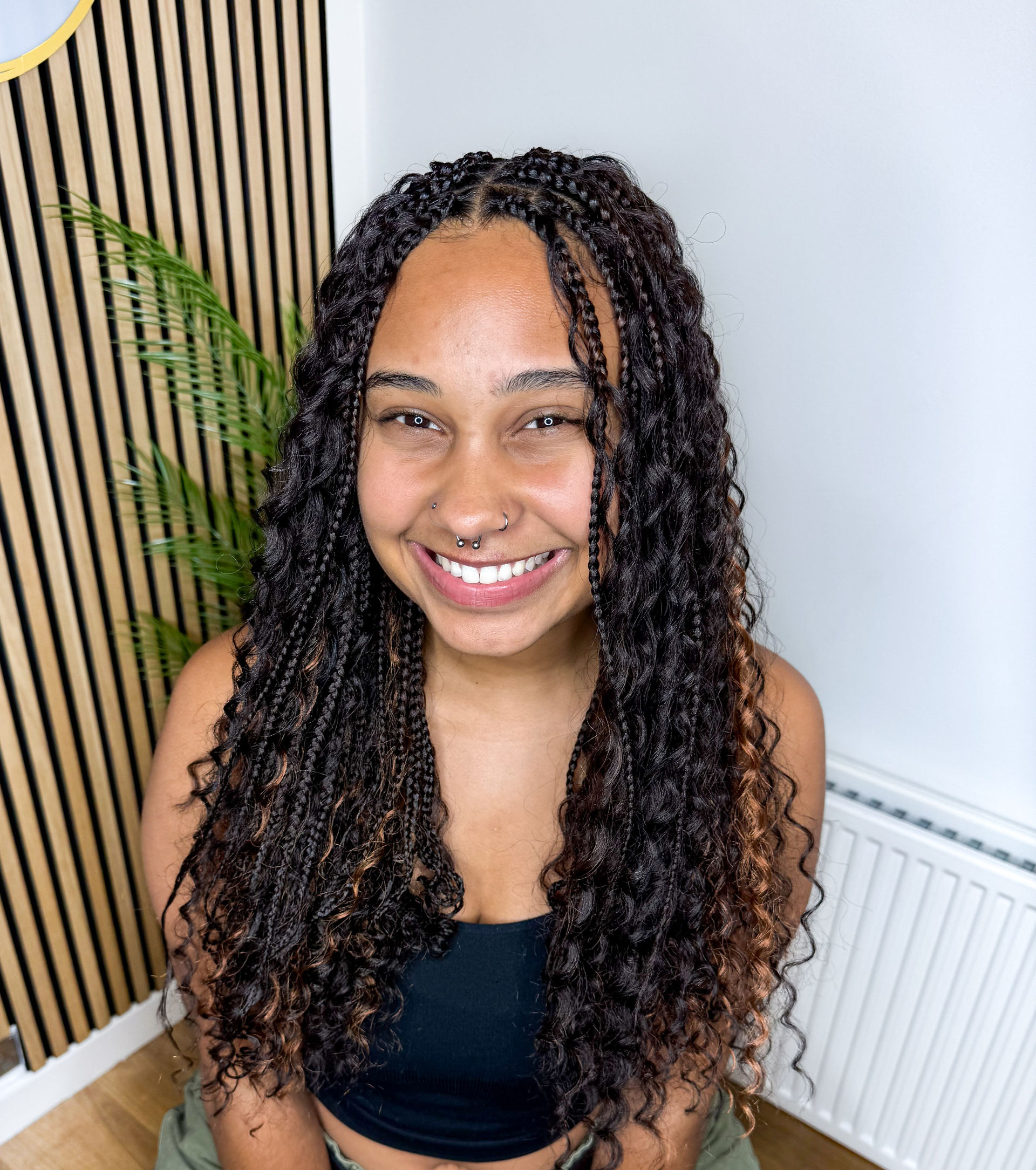 Boho braids with loose curls blended throughout the hairstyle