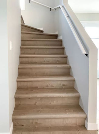 Modern staircase with laminate flooring and angled steps