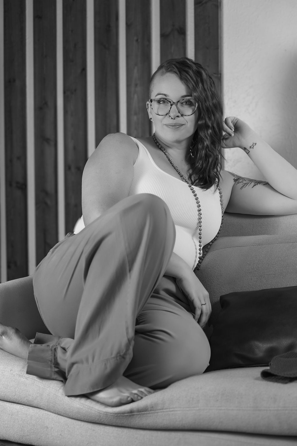 Jorden sitting on a couch | Jorden Anderson Consulting