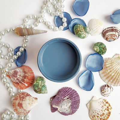 Small bowl of Mineral Paint Deep Lake with seashells and pearls