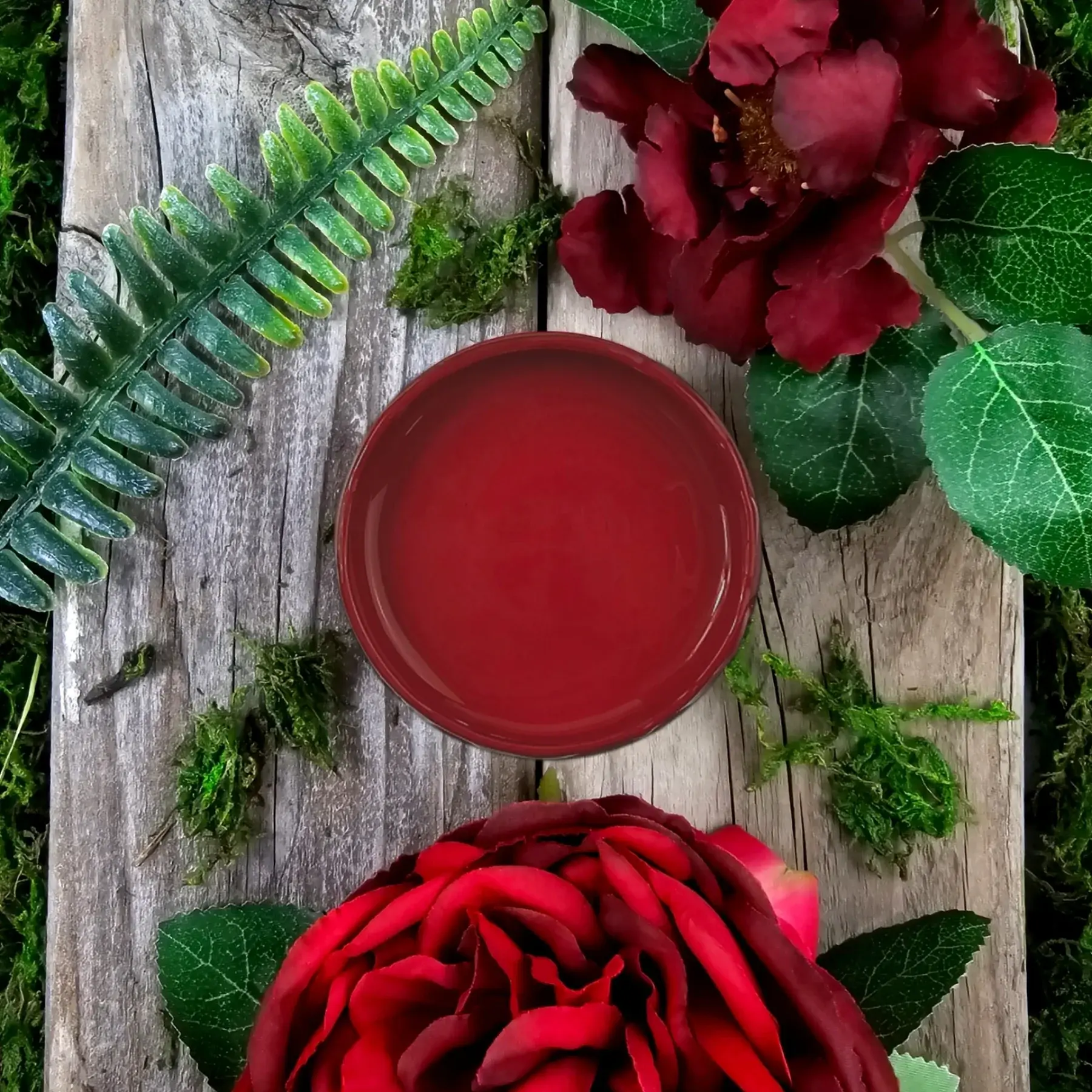 Red mineral paint lid on wood with roses and ferns.