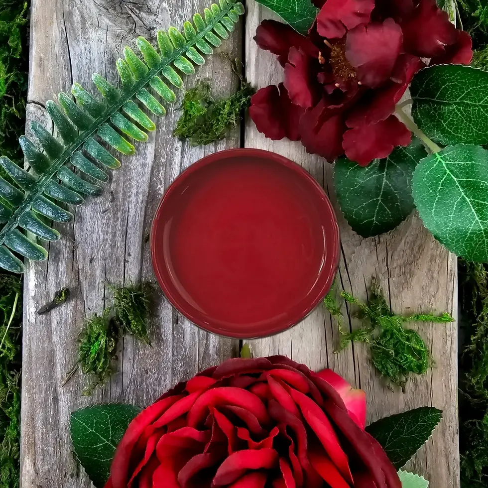 Red mineral paint lid on wood with roses and ferns.