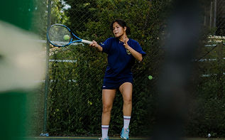 International student playing tennis at BOSS Summer School professional Tennis Academy.