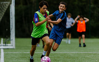 International students playing football at BOSS Summer School professional Football Academy.