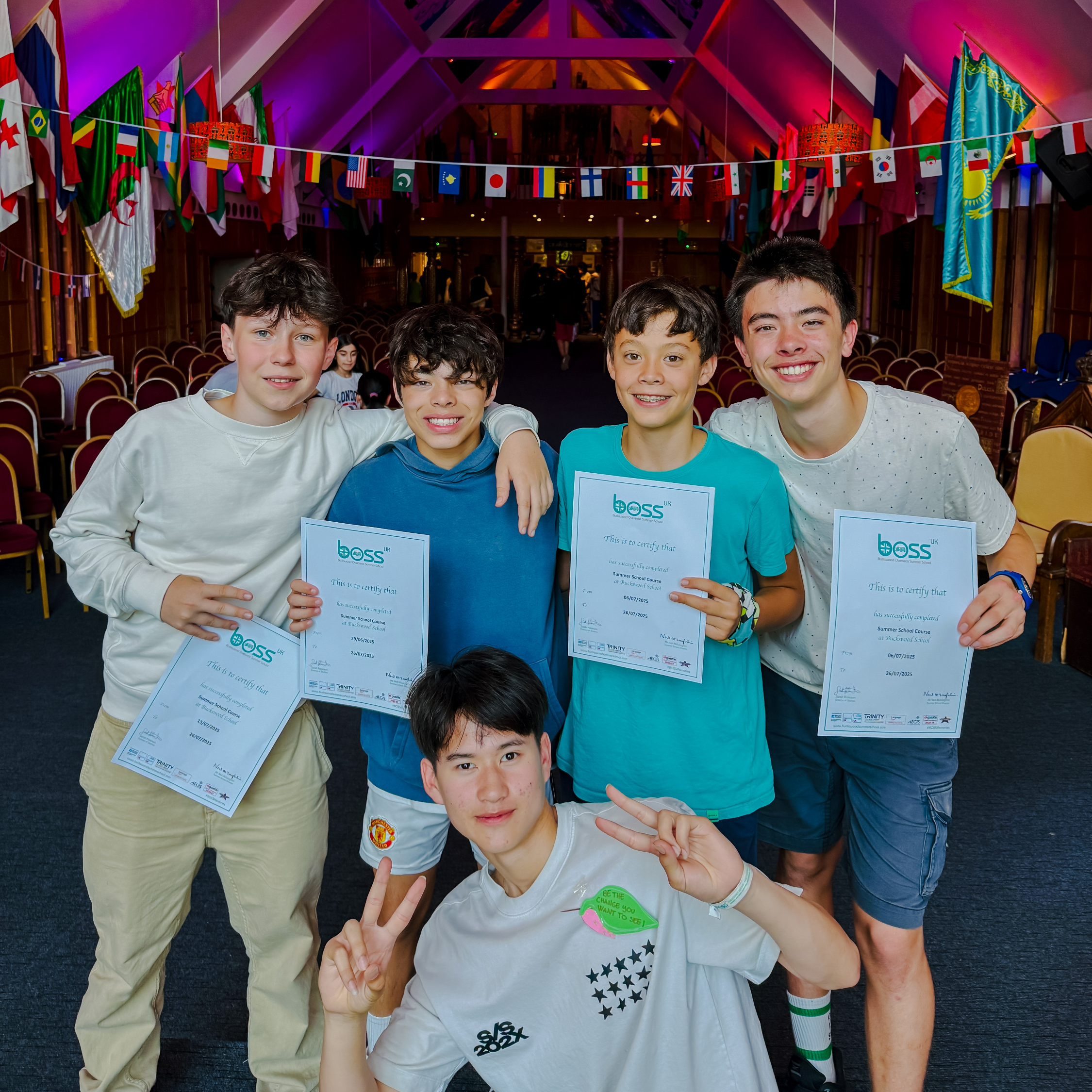 Students at graduation with certificates