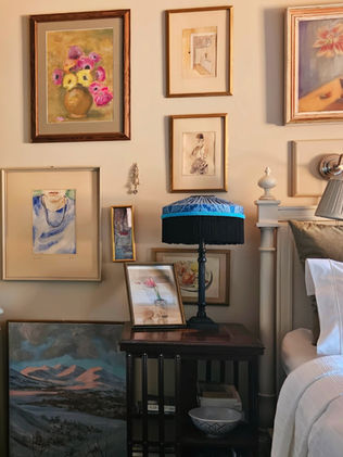 Antique furniture and oil paintings in a beautiful bedroom.