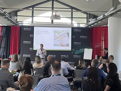 Executives and business leaders attending Steve Kim's presentation on the 7P Business Alignment Framework at the Drucker School of Management.