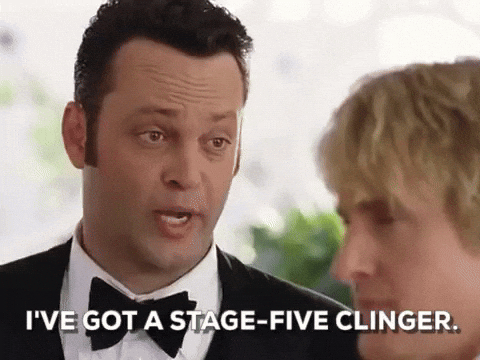 Man in a tux speaks to a blond man in a bright indoor setting; subtitle reads I’VE GOT A STAGE-FIVE CLINGER.