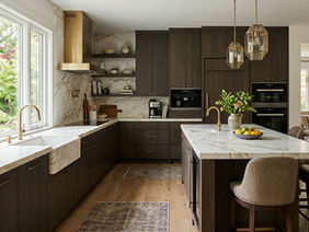 Modern L Shaped Kitchen Interior with dark wood cabinets and a marble island.