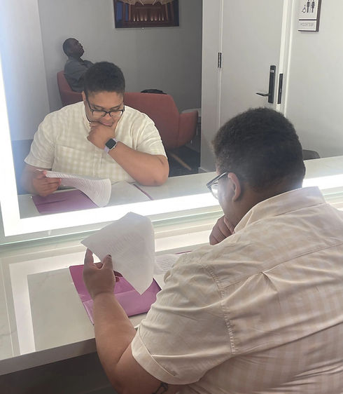 Writer Kellie Wood looks at a draft in her dressing room before performing one of her funny personal essays.
