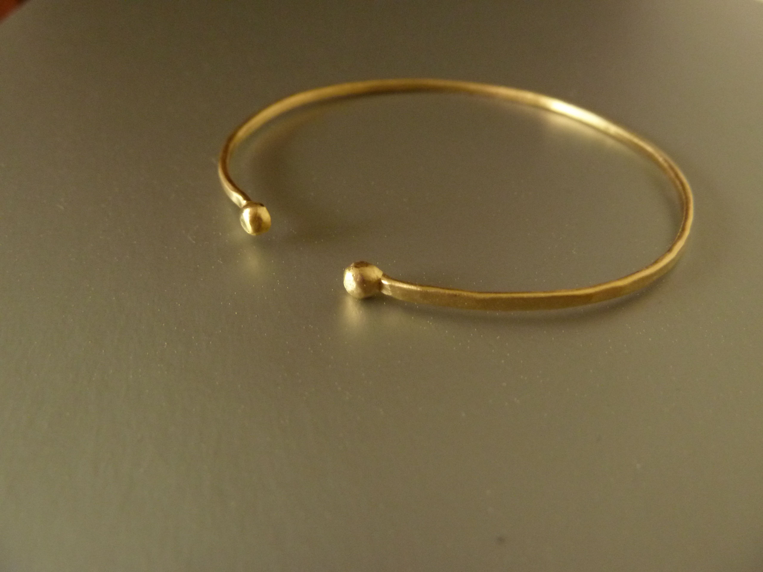Thin Hammered handmade cuff bracelet, 18 kt gold plated.