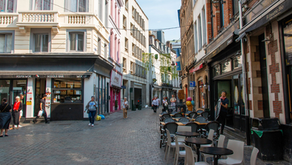 People exploring a walkable Québec community with local businesses, public spaces and everyday neighborhood activity