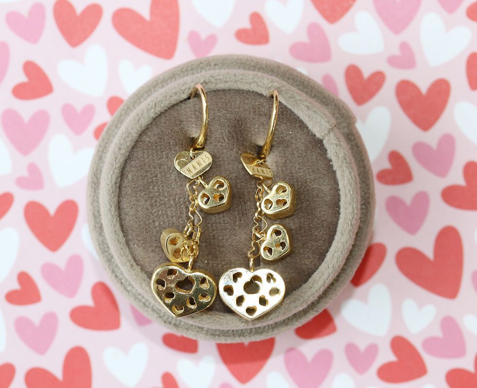 Gold dangly heart-shaped earrings