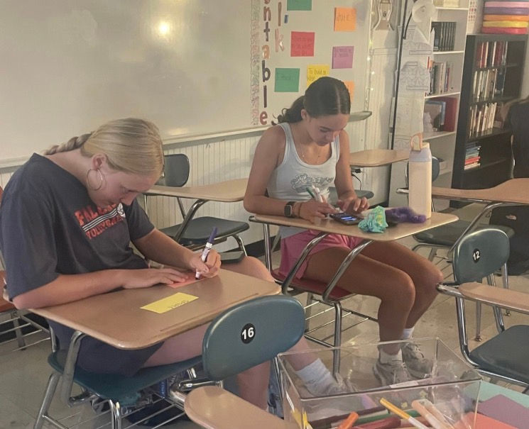 Free Flow club members work on cards (Photo courtesy of Amelia McKinney)