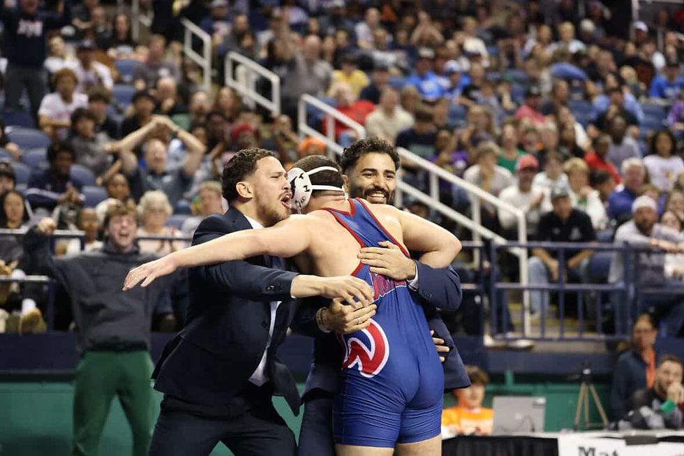 Alkurdasi hugging his coaches