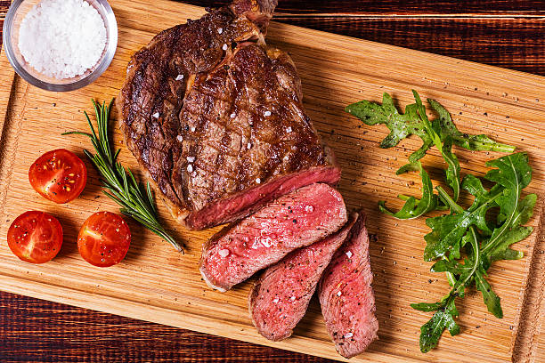 Steak on a cutting board. The Flame Catering.