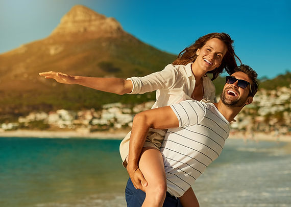 portrait-couple-piggyback-by-ocean-love-commitment-bonding-summer-vacation-honeymoon-man-w