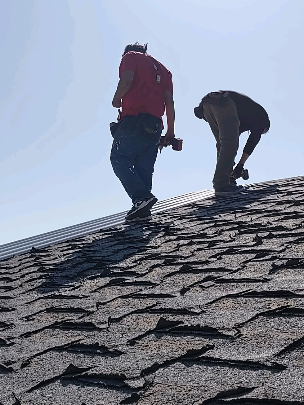 Lakota Empowerment Group workers working on a roof