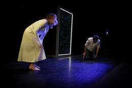 Theatre Lighting Programmer London a woman in a white dress stands next to a man on a stage