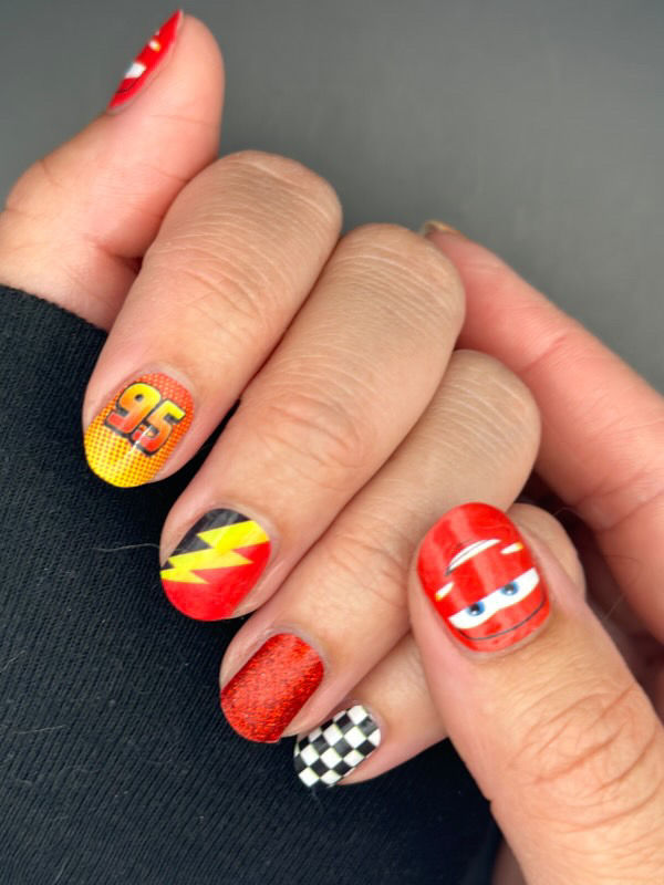 Thumbnail: Disney Cars nail art with 95 numbers, speed graphics, and red/yellow accents