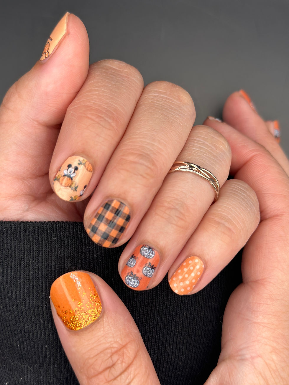 Thumbnail: Pumpkin Picking Mouse Disney Halloween nails styled with plaid, glitter, pumpkins, and Mickey pumpkin designs for fall.