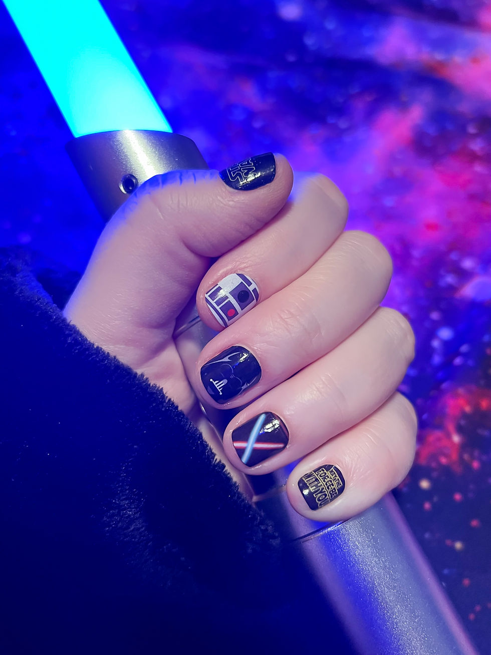 DIY Star Wars nails with character-themed designs and lightsaber graphics