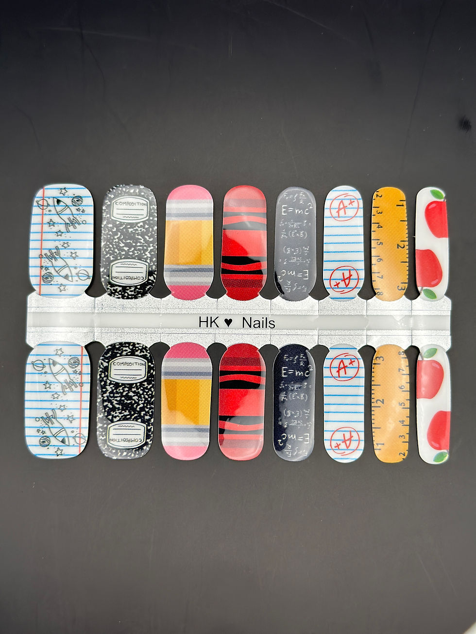 Thumbnail: Teacher appreciation nail art with science, math, and red apple icons