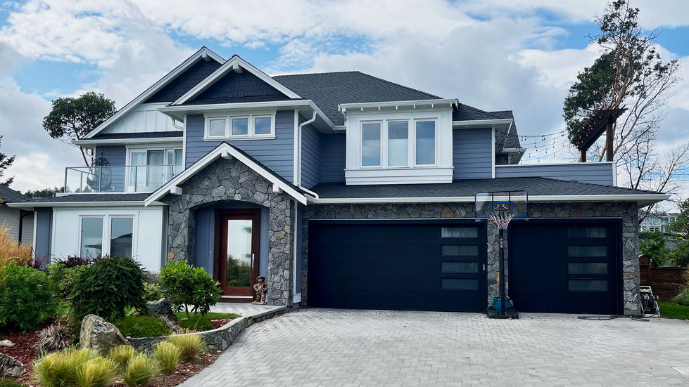 Arts & Crafts style home beautifully combining Hardie Plank and Hardie Panel siding, showcasing the blend of traditional desi