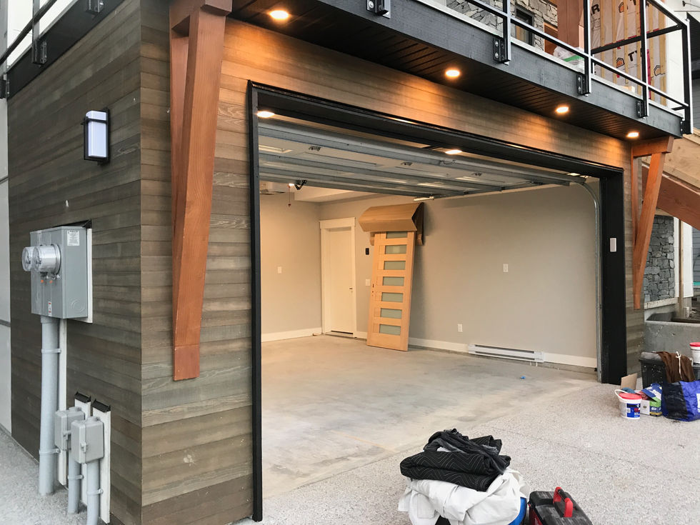 Exterior view of a home featuring a combination of cedar and siding materials, showcasing the natural warmth and texture of cedar alongside the durable and versatile appearance of siding, enhancing the architectural elegance and curb appeal of the property.