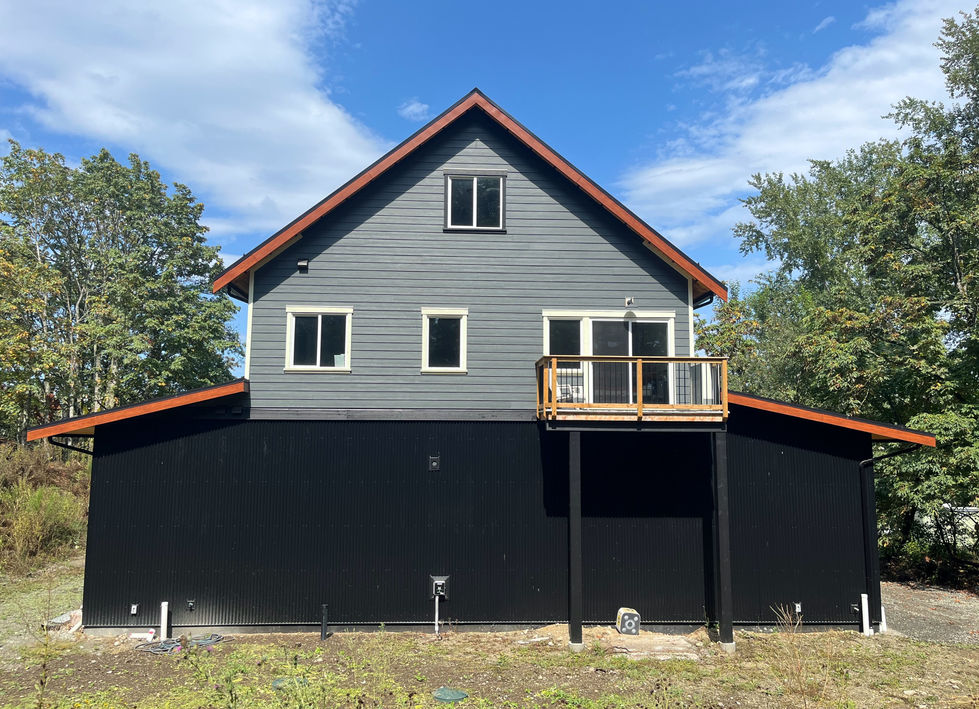 Renovated barn outfitted with Metal Siding and ColorPlus Hardie Plank, displaying a durable and modern exterior with a blend
