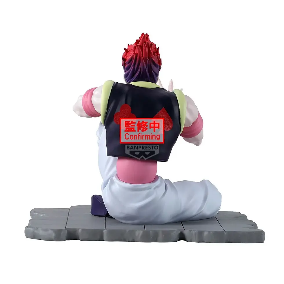 Hisoka figure in pose with text on his vest, white pants, red hair, and base.
