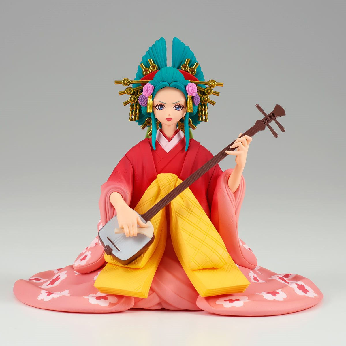 Geisha figure in red kimono plays a shamisen, Japanese musical instrument.