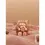 Thumbnail: Plush toy holding a flower, resting on pink fur, with chocolate bars background.
