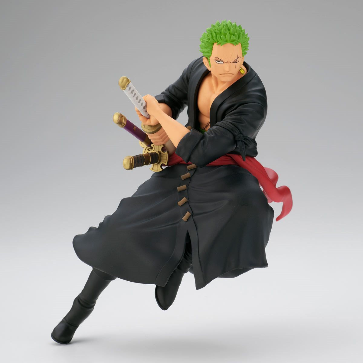 Zoro figure with swords, poised in action, black outfit, ready for battle.