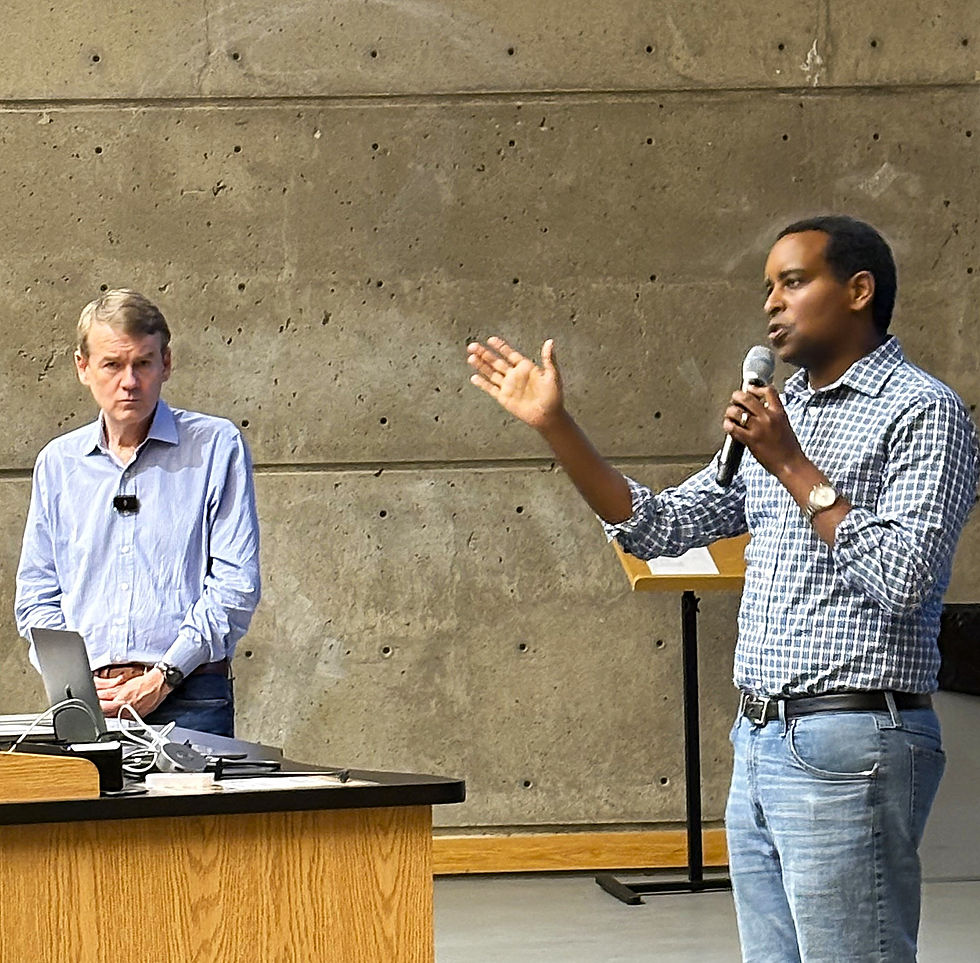 Sen. Michael Bennet and Congressman Joe Neguse talk to voters in Colorado's 2nd congressional district during a town hall at the University of the Colorado.