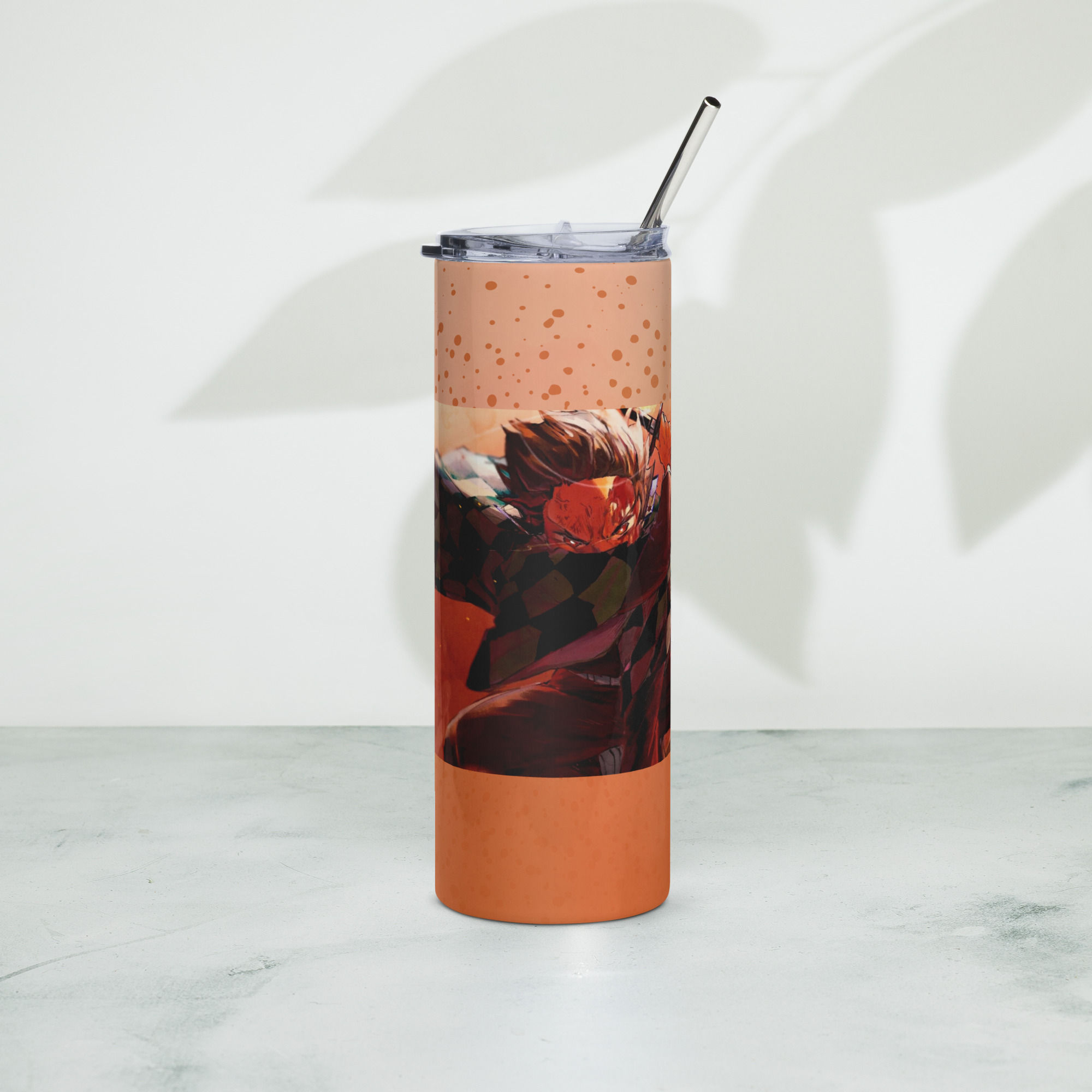 Tanjiro 20 oz stainless steel tumbler front view with orange action artwork and metal straw