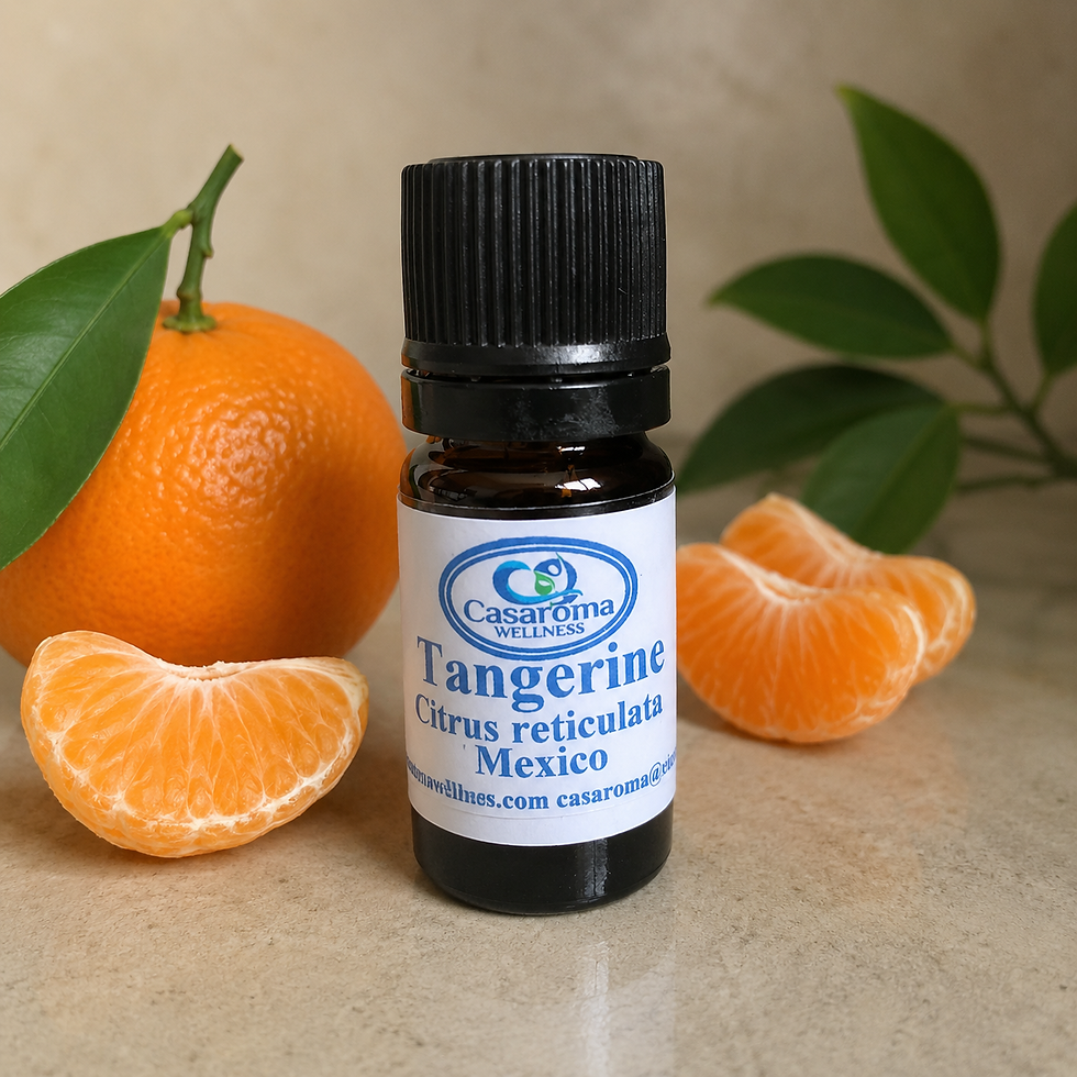 Tangerine pieces with bottle of Casaroma tangerine essential oil