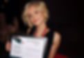 Taydam holding up her SA Wome's finalist award