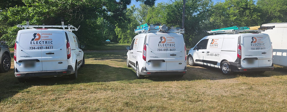 Three white 3D Electric vans with the Dependable Diligent Determined logo and phone number 734-697-8477 parked on grass